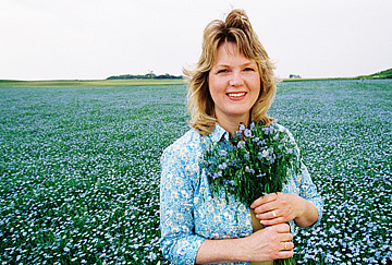 Esther Hylden R.N. in a field of flax