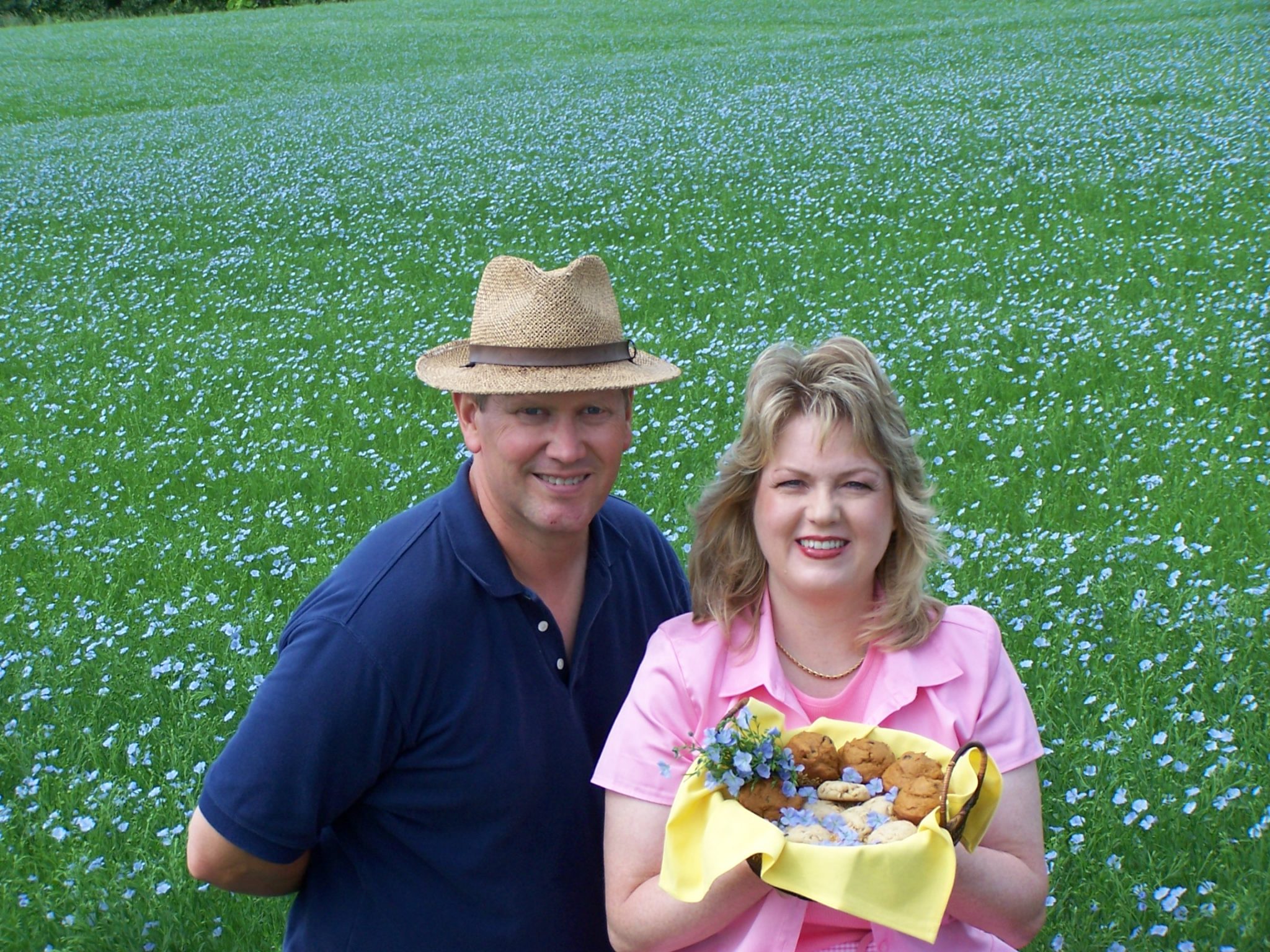 Mark & Esther Hylden in a field of bloming flax