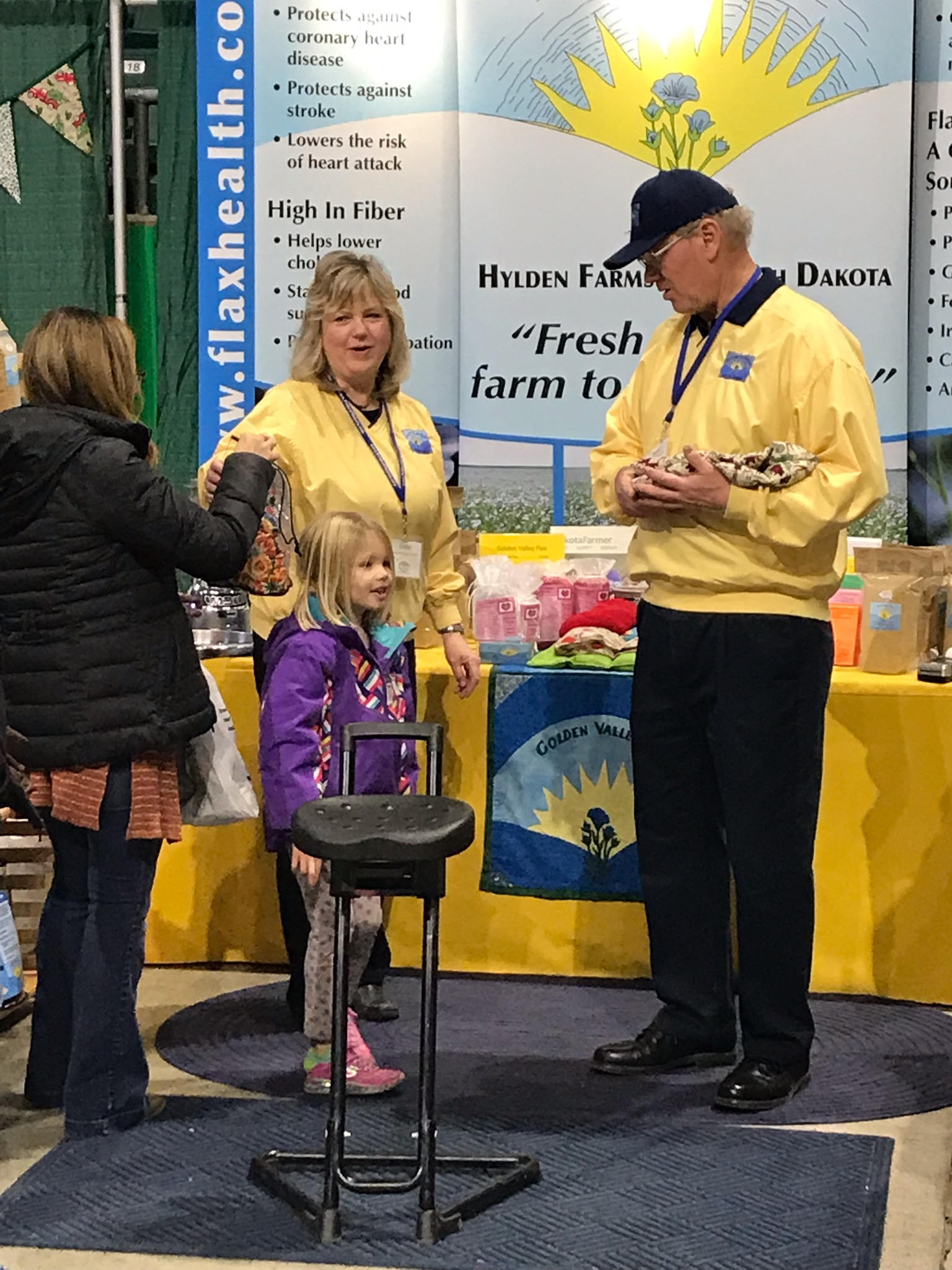 Esther & Mark with little customer. Flax strengthens immune system.