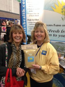 Esther at Fargo show with Facebook winner of flax bag