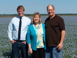 Hylden family in a field of flax