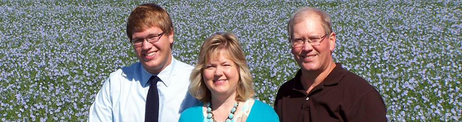 Hylden family in a field of flax